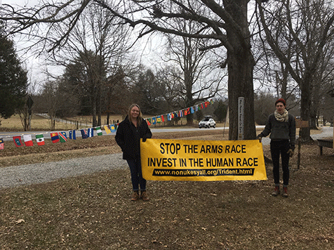 Rebecca Obermeier and John Gagnon celebrate 3rd anniversary of U.N. Treaty on the Prohibition of Nuclear Weapons by Tree of Peace and Peace Pole in Sautee, Georgia