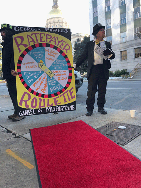 Tom Ferguson with Ratepayer Roulette Wheel of Misfortune at the Georgia Capital